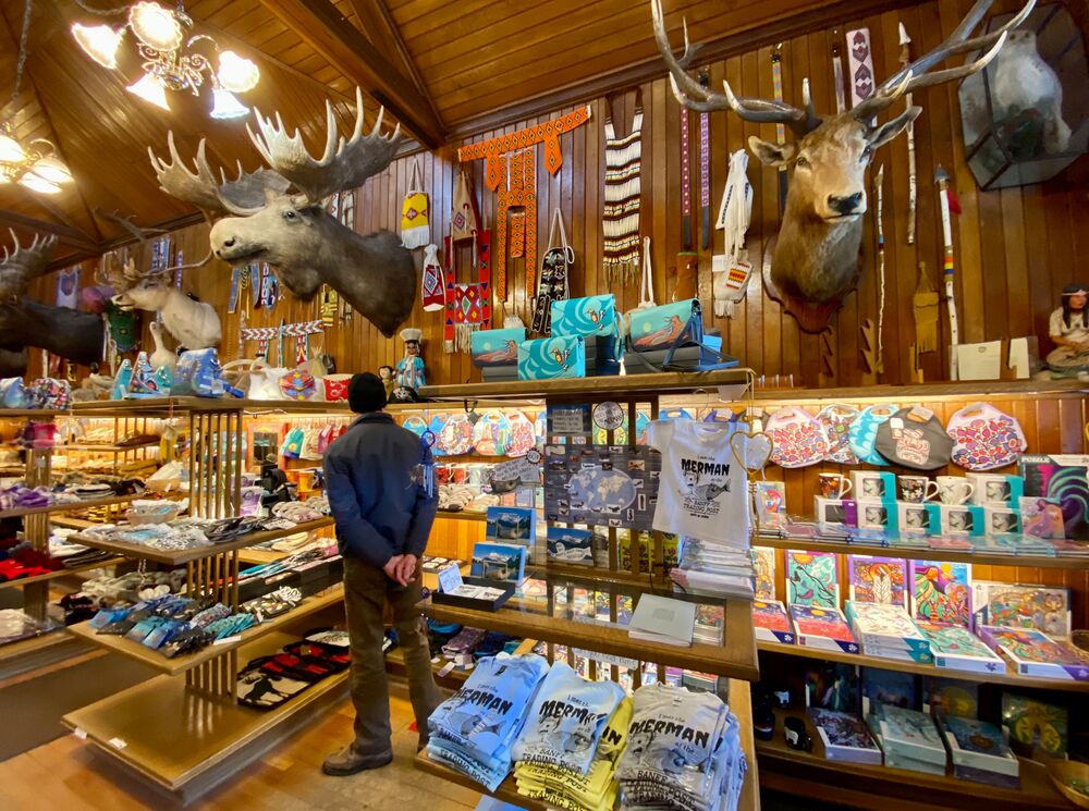 A person looks at the things inside the Banff Trading Post